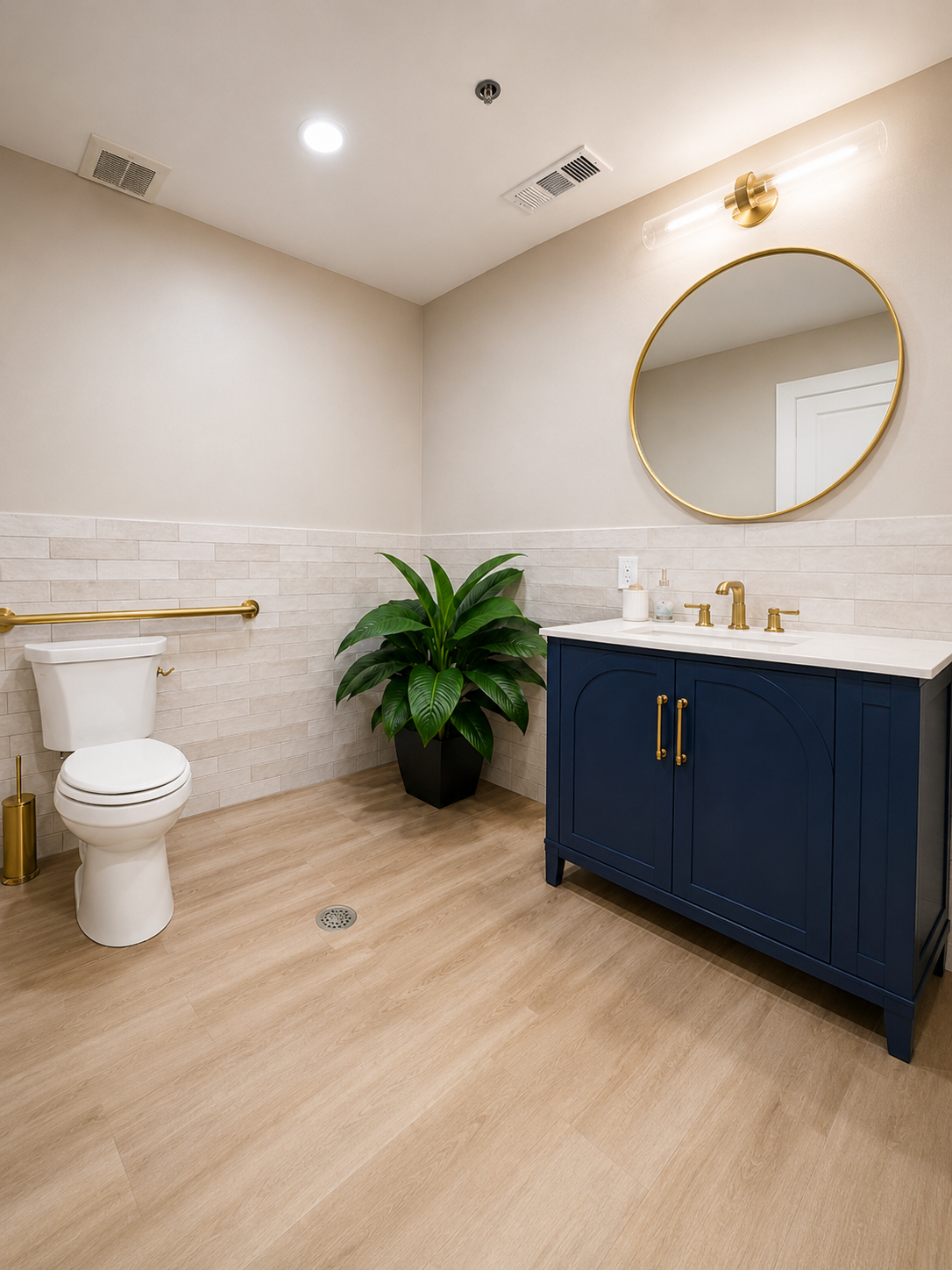 ADA bathroom with gold grab bars, subway tile, and wood-look flooring