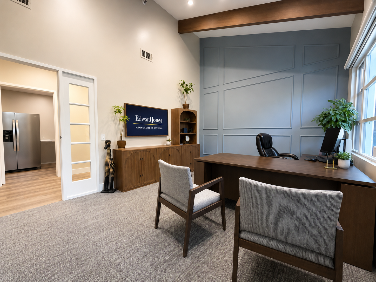 Executive office with paneled accent wall and client seating