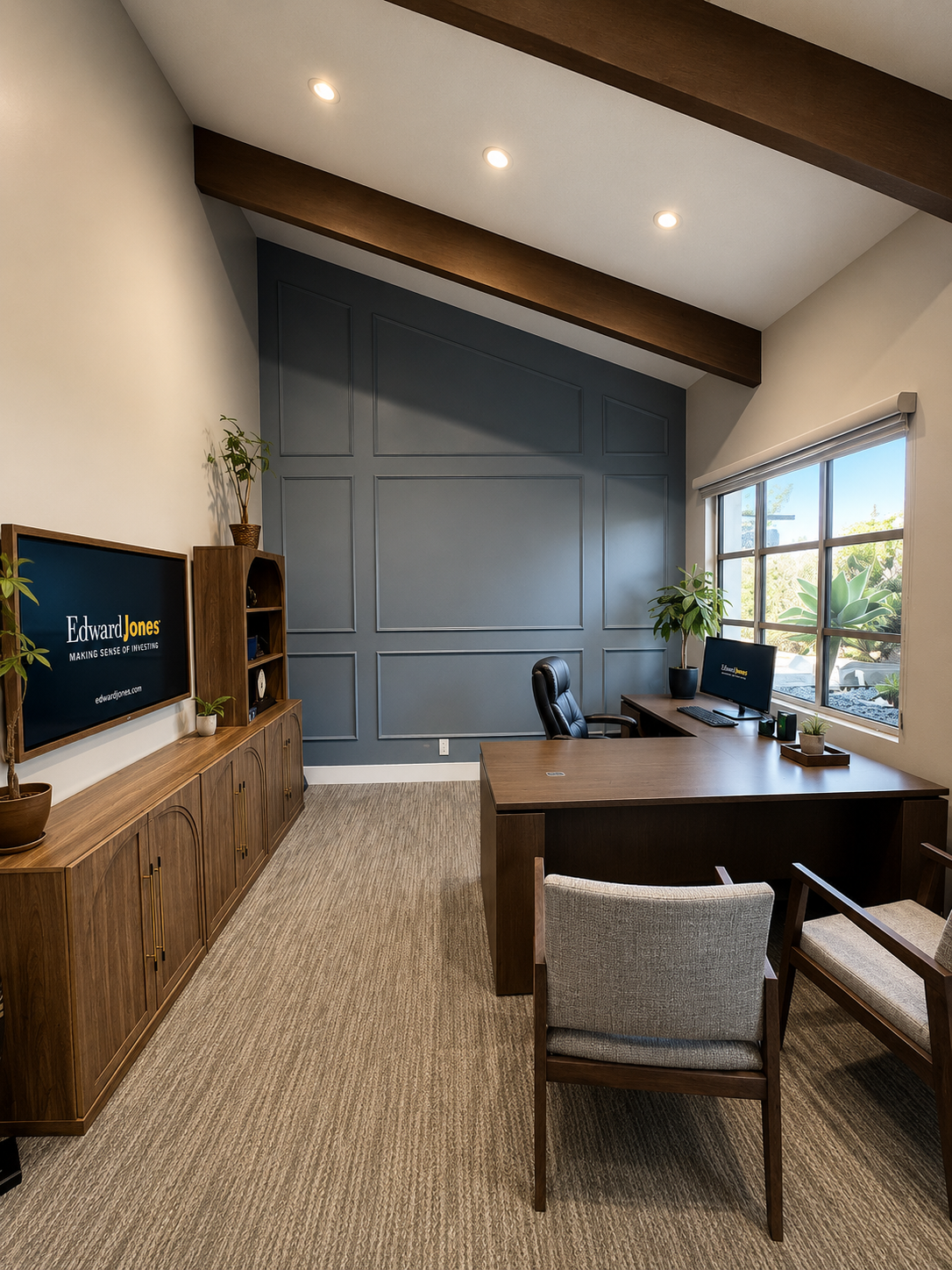 Private office with vaulted ceiling and paneled feature wall